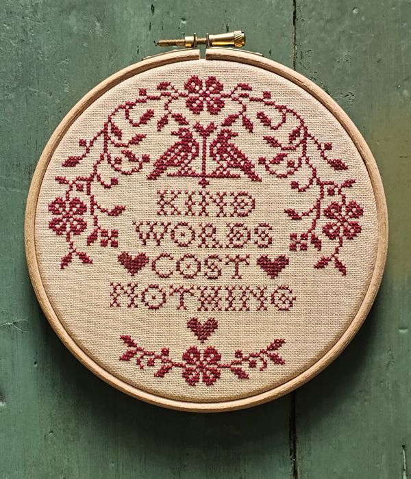 Kind Words Cost Nothing - an embroidery hoop cross stitch projec charted by Modern Folk Embroidery